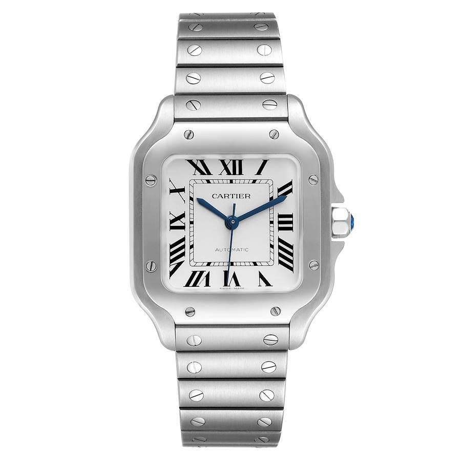 Cartier Santos Silver Dial Medium Steel Mens Watch WSSA0029. Automatic self-winding movement. Stainless steel case 35.1 x 35.1 mm. Octagonal crown set with the faceted blue spinel. Stainless steel bezel punctuated with 8 signature screws. Scratch