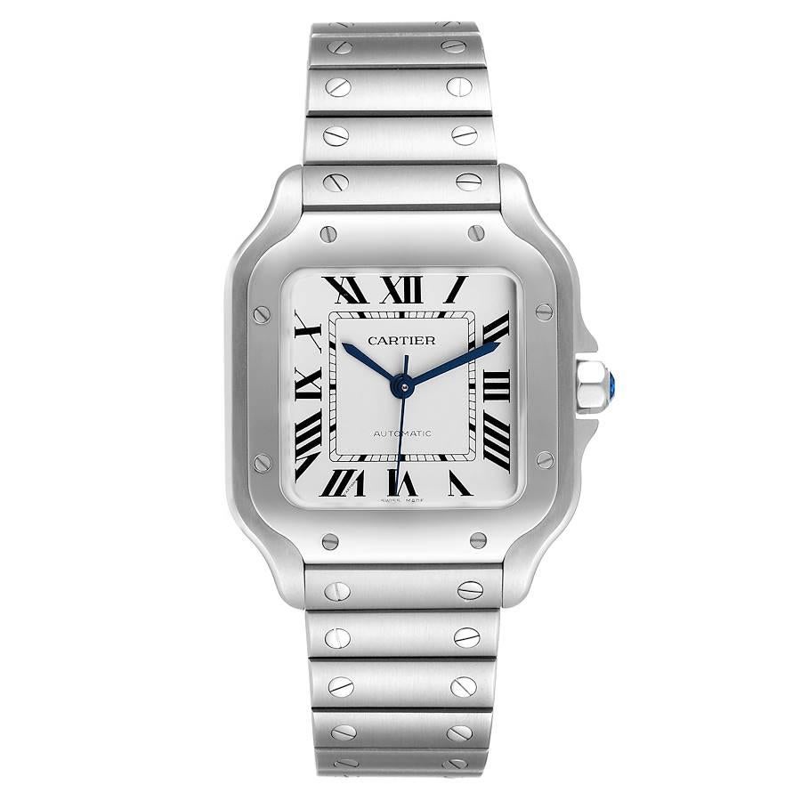 Cartier Santos Silver Dial Medium Steel Mens Watch WSSA0029 Unworn. Automatic self-winding movement. Stainless steel case 35.1 x 35.1 mm.  Octagonal crown set with the faceted blue spinel. Stainless steel bezel punctuated with 8 signature screws.