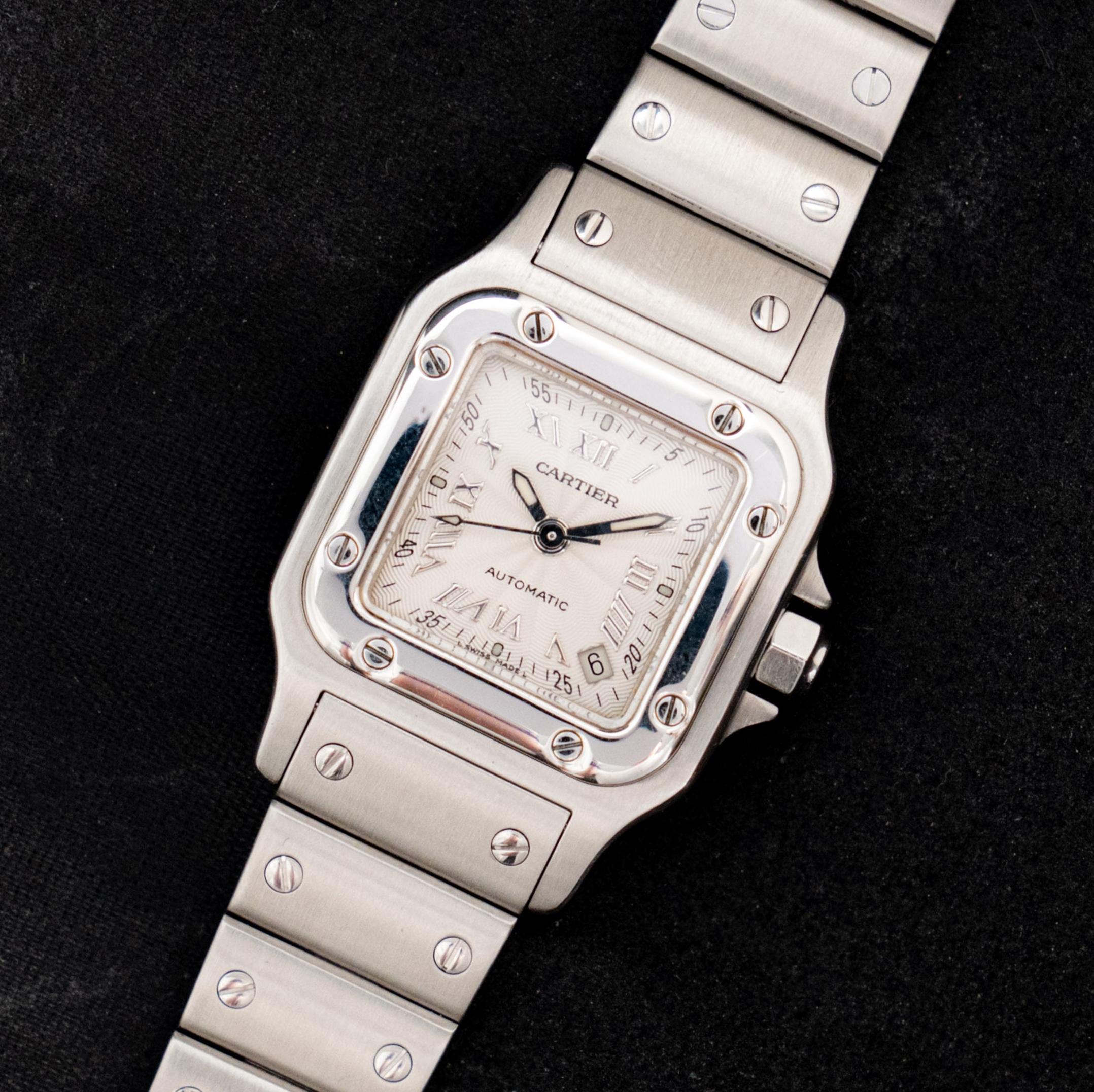 Brand: Cartier
Model: Santos Galbée 2423
Year: 2000’s
Serial Number: 780xxxxxx
Reference: C03913

Case: Show sign of wear with the Stainless Steel Case in size 24 x 35mm without crown; Cartier serial numbers engraved on the case back

Dial: