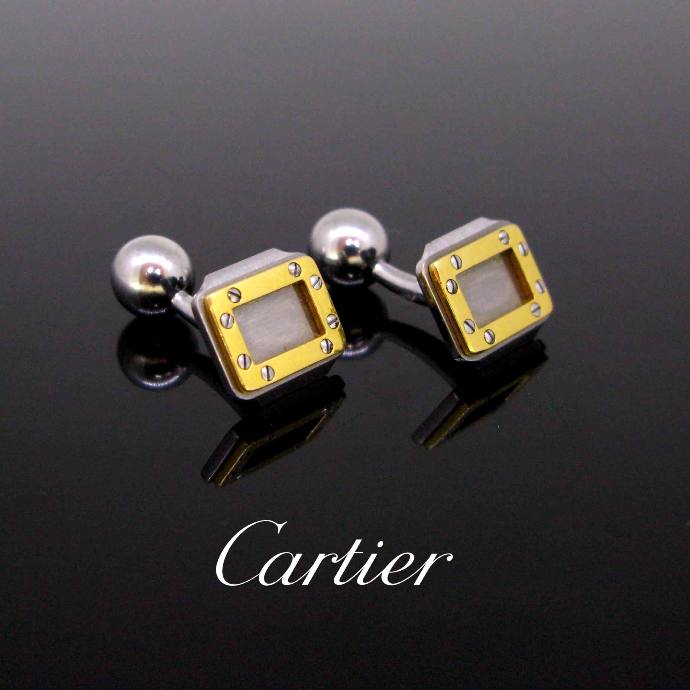 This pair of cufflinks comes from the Santos de Cartier Collection. They are made in Steel and enhanced with a screw motif in 18kt yellow gold on the front. The cufflinks are in very good condition. They are signed and numbered on the back. They