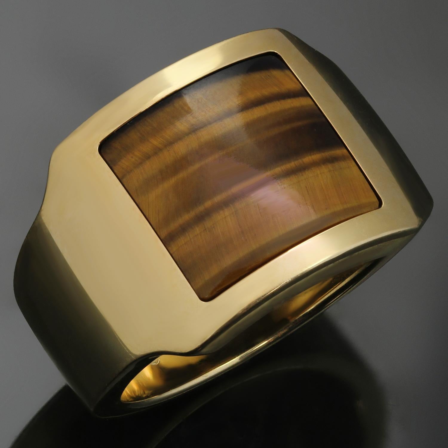 This rare Cartier men's ring from the classic Santos collection is crafted in 18k yellow gold and set with square-cut tiger eye. Made in France circa 1990s. Measurements: 0.62