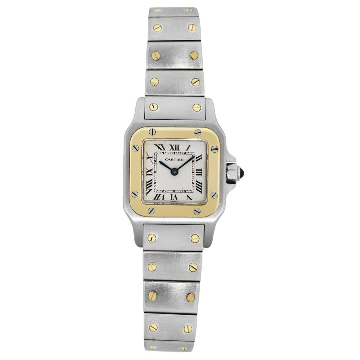 Brand: Cartier
Model: Santos
Case Material: Stainless steel
Case Diameter: 26mm
Crystal: Sapphire crystal
Bezel: Smooth 18k yellow gold bezel with stainless steel Cartier screws
Dial: Off-White dial with black roman numerals. Blue hour and minute