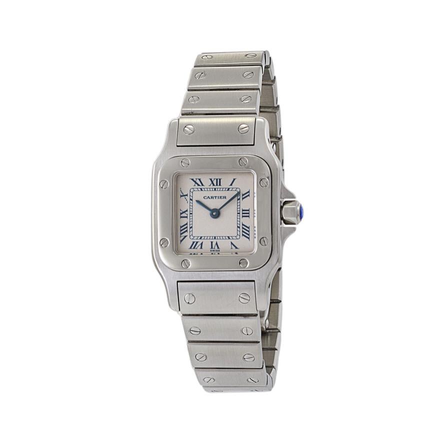 This is a great condition Cartier Santo Galbee reference 1565. This watch is stainless steel and has a 24mm case and sapphire crystal. The dial of this particular example is white with blue Roman numeral hour markers. The Cartier logo is