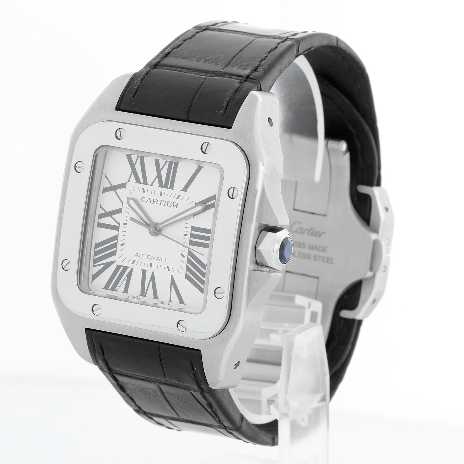 Cartier Santos XL 100 Steel Automatic Men's Watch W20073X8 2656 - Automatic winding. Stainless steel case (38mm x 41mm). White dial with black Roman numerals. Black leather Cartier strap with stainless steel Cartier deployant. Pre-owned with Cartier