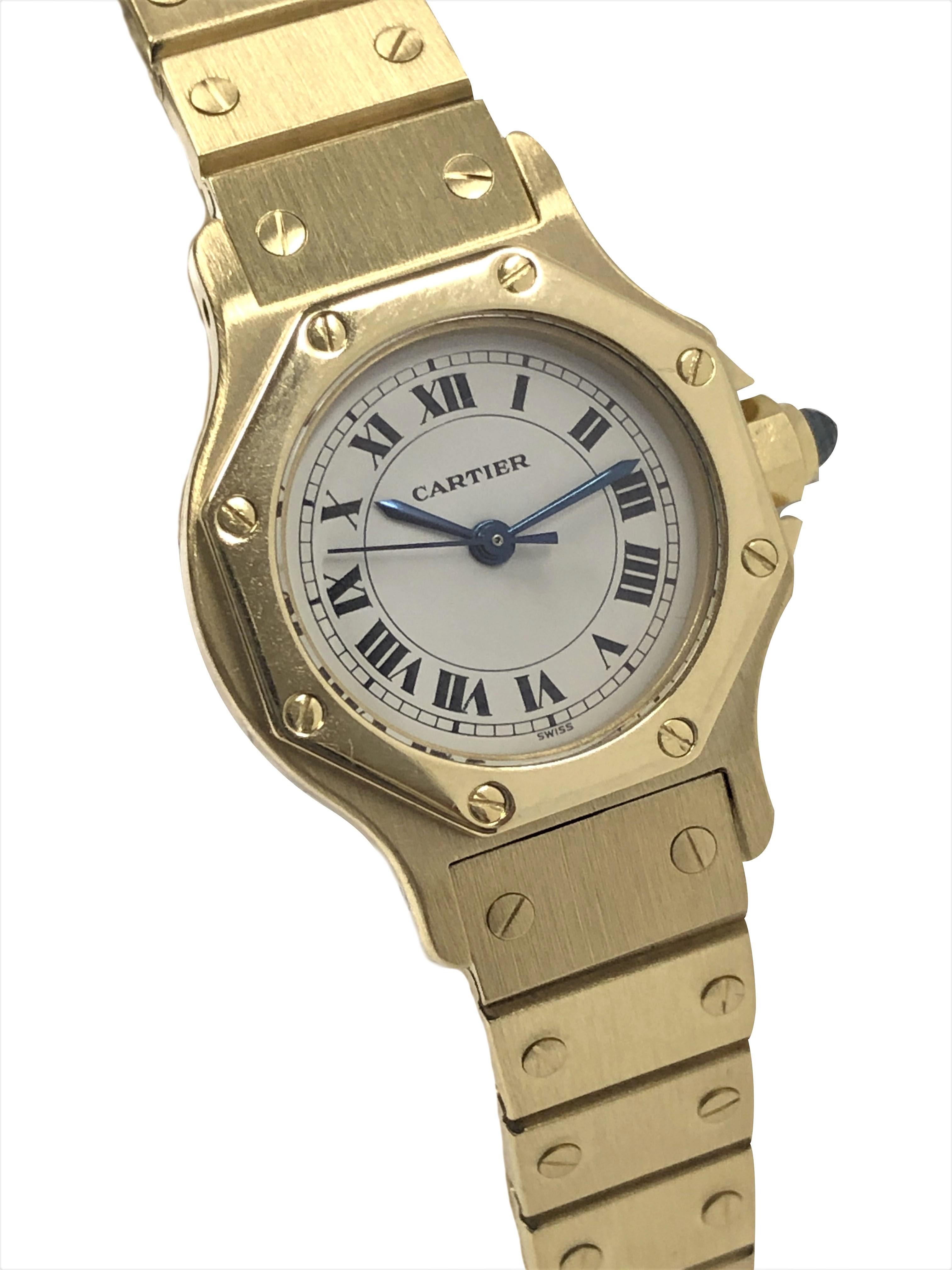 Circa 1990 Cartier Santos Collection Ladies Wrist Watch, 26 M.M. Octagon 18k Yellow Gold 2 Piece water resistant case, Automatic self winding movement, White Dial with Black Roman numerals, sweep seconds hand and a Sapphire crown. 1/2 inch wide