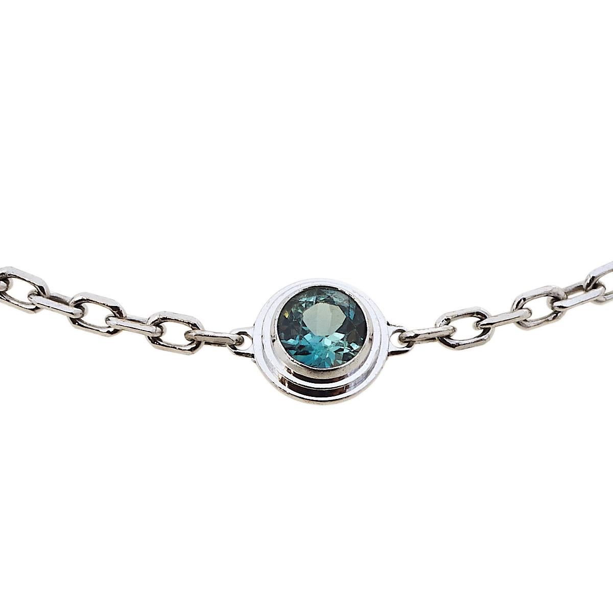 Simple is the new elegant and this bracelet from Cartier is a clear example of the same. The 18k white gold chain bracelet is centered with a green sapphire and finished with an adjustable lobster clasp. This understated piece is effortlessly