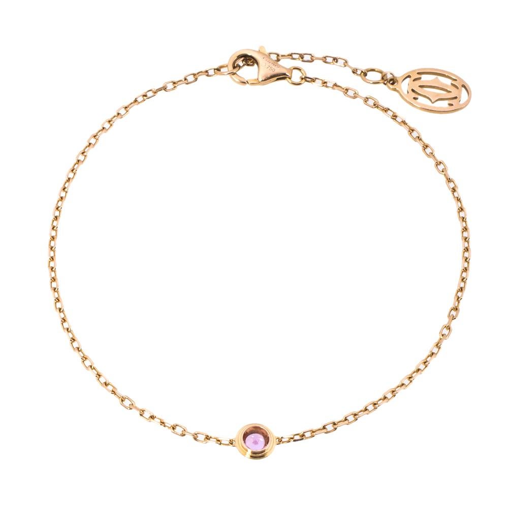 Simple is the new elegant and this bracelet from Cartier is a clear example of the same. Cartier 18k rose gold chain bracelet is centred with a pink sapphire and finished with an adjustable lobster clasp closure. This understated piece is