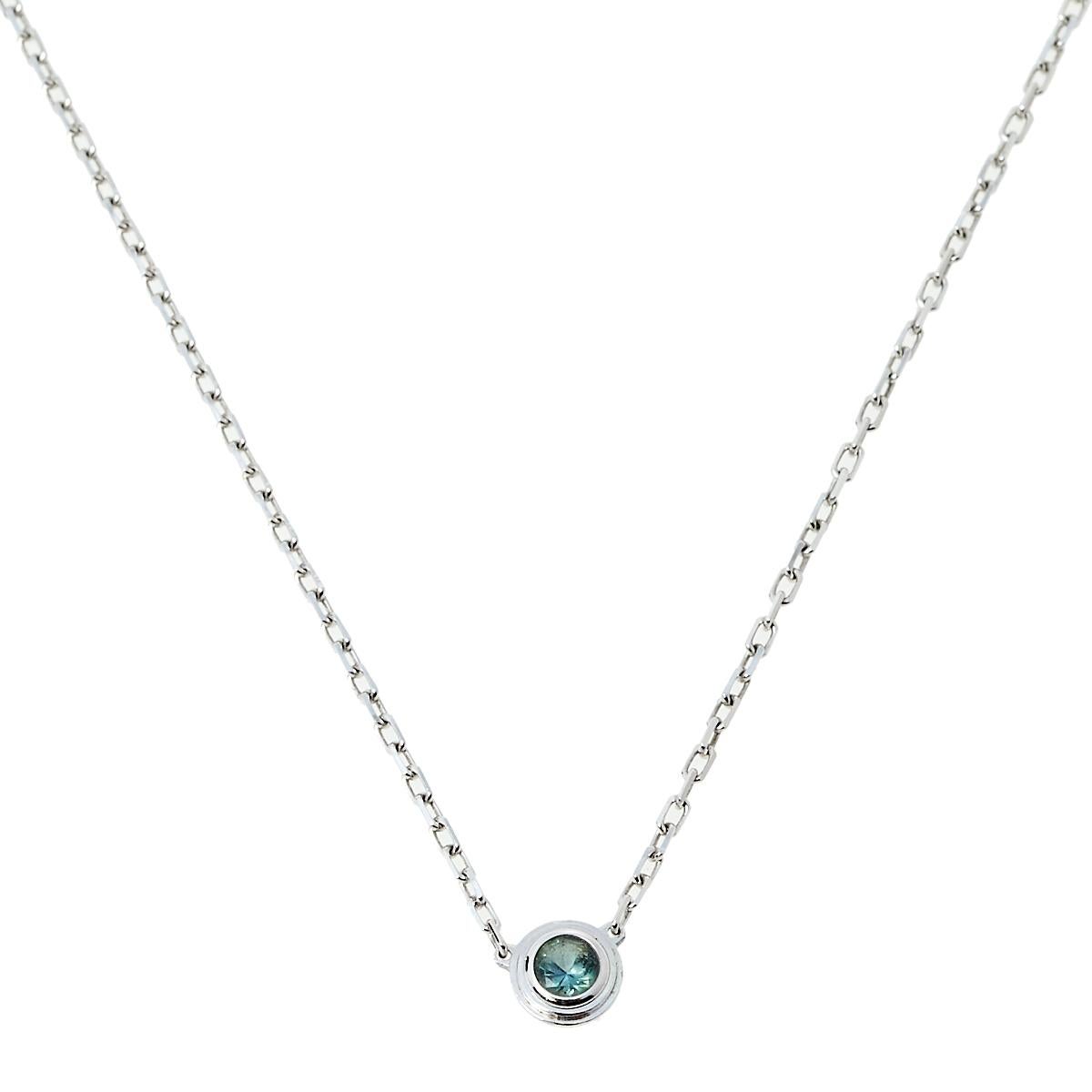 Simple is the new elegant and this necklace from Cartier is a clear example of the same. Cartier 18k white gold, this necklace is centered with a sapphire pendant held by a slender chain and finished with a lobster clasp closure. This understated