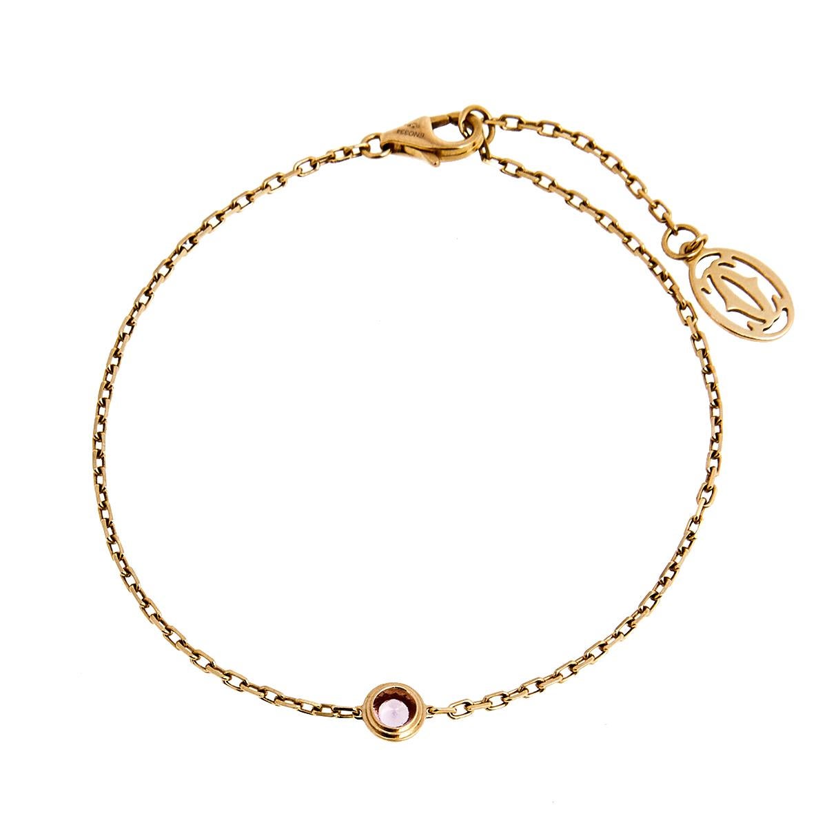 The Saphirs Légers de Cartier bracelet adds a feminine touch, accented with a shimmering pink sapphire. Made from 18k rose gold, its dainty chain is equipped with a lobster clasp closure and a Cartier CC charm, giving it a classy aesthetic.