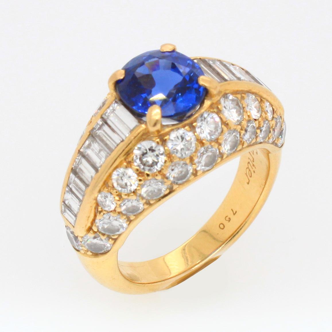 A sapphire and diamond ring in 18k yellow gold, Cartier, France 1960s. The cushion shaped sapphire is an absolutely clean gemstone with a beautiful intense blue colour. It is of Ceylon origin and natural, not heat treated - accompanied by a