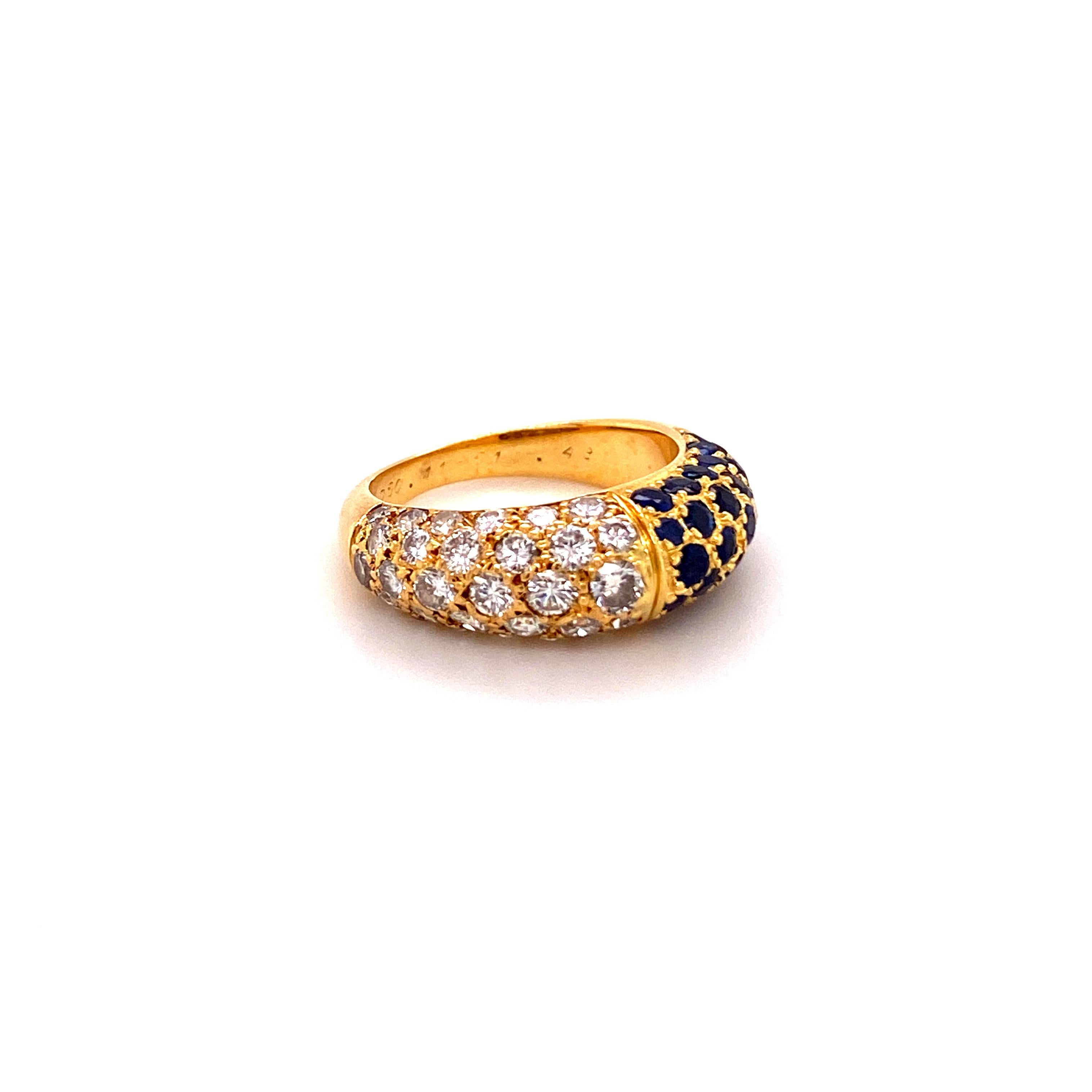 This ring by Cartier is carefully crafted in 18 karat yellow gold. Set with 30 brilliant cut sapphires of approximately 0.80 carats and 30 brilliant-cut diamonds of F/G color and vs clarity, total weight approximately 0.80 carats.

Signed and