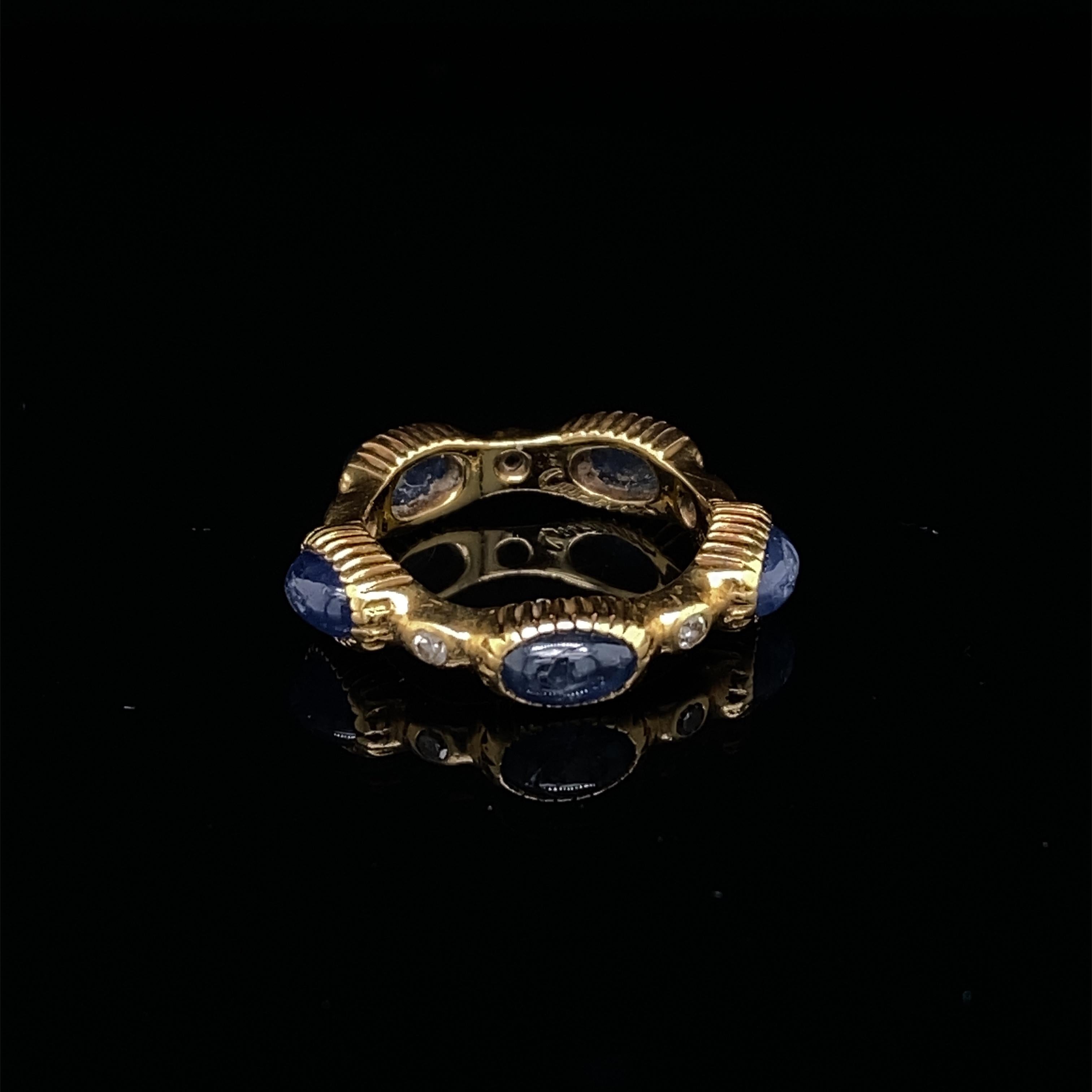 A Cartier sapphire diamond full eternity ring in 18 karat yellow gold, circa 1960.

This stylish retro Cartier ring is full set with alternating vibrant blue sapphire cabochon and round brilliant cut diamonds.
 
When viewed from the side the ring