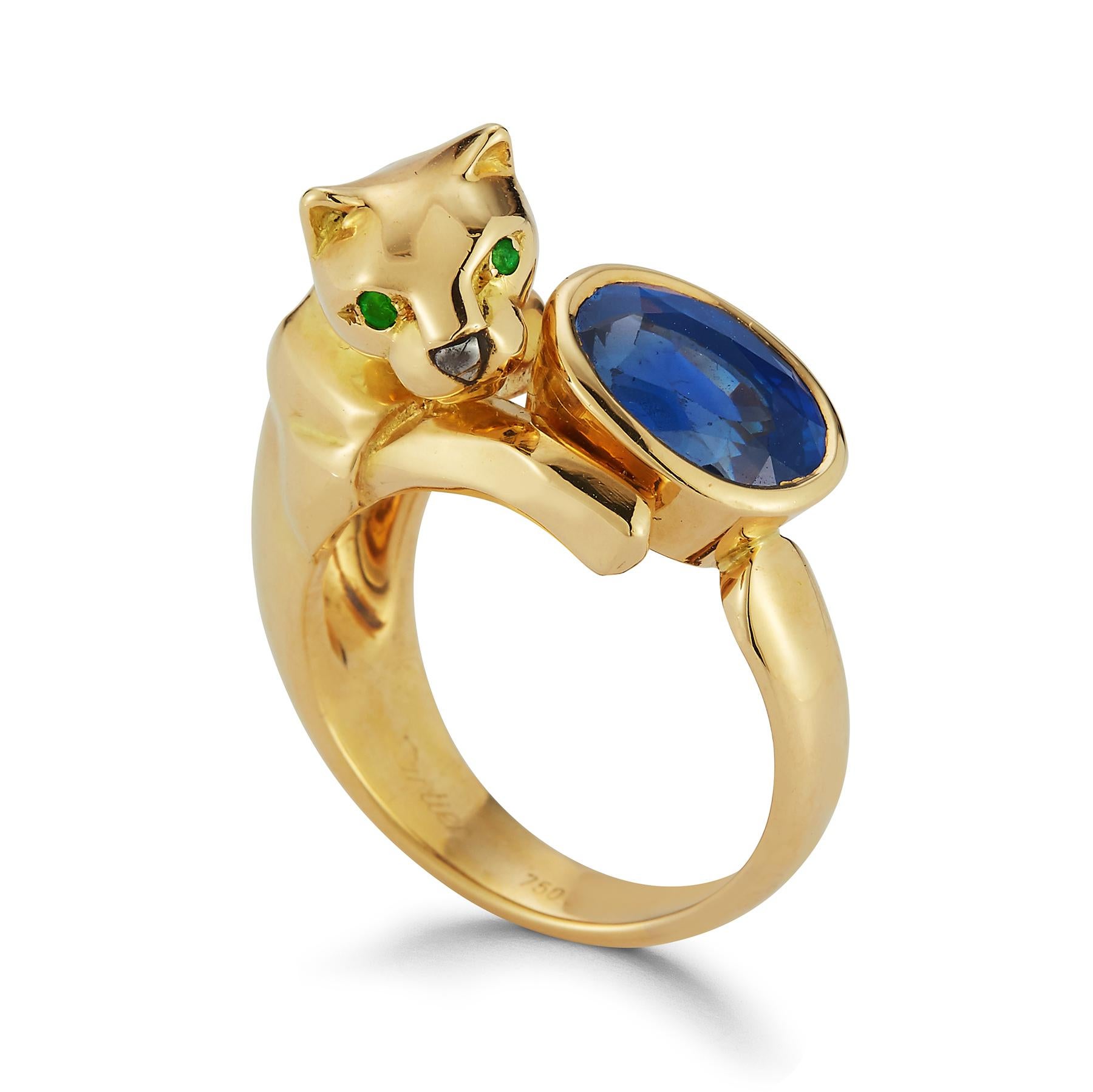 Cartier Sapphire Gold Panther Ring , 1 oval cut sapphire as the center. 2 round cut emeralds for the panther eye set in 18k yellow gold.

Sapphire Weight: approx 3.00 cts 

Size 5.5

Resizable 

Signed Cartier and numbered