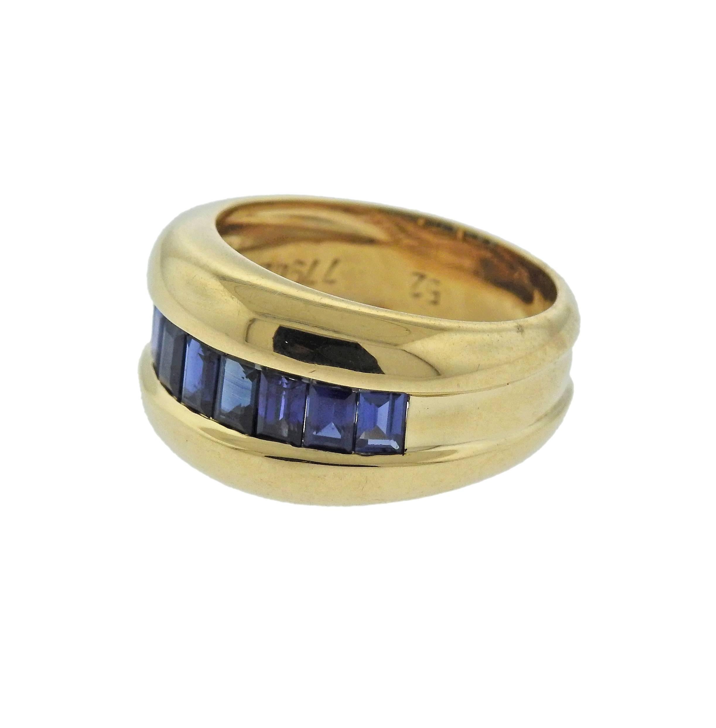 18k yellow gold ring crafted by Cartier featuring baguette cut sapphires. Ring size - 6, ring top is 11mm wide, weighs 8 grams. Marked: Cartier, 52, 779422, 750.