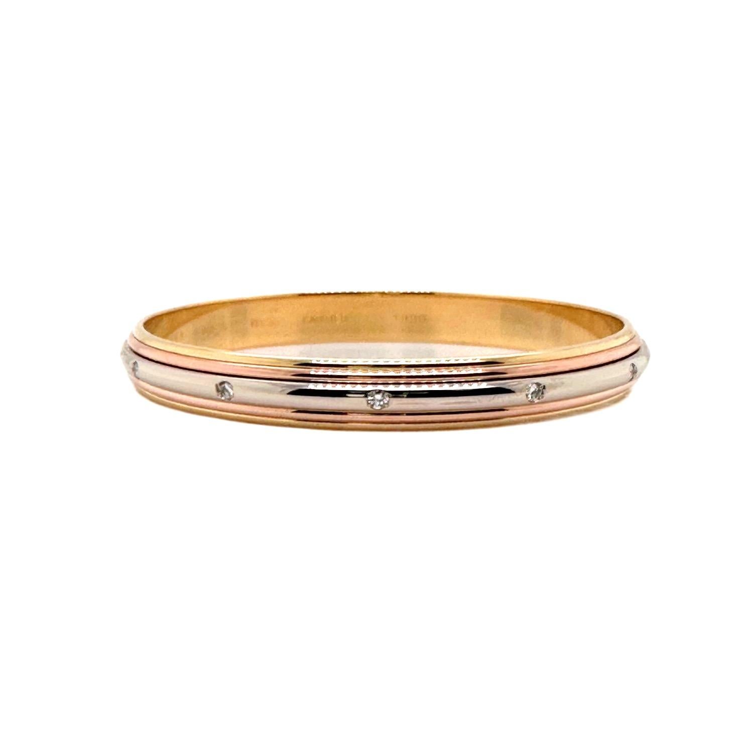 Cartier Saturne Collection Multi-Tone Gold Diamond Bangle Bracelet
Style:  Bangle
Ref. number:   B46468
Metal:   Multi-Toned 18kt White Yellow Rose Gold 52.2 grams
Size:  7.5' inside measurement,  2.5' Inches Length, 8.5 mm Width
Diamonds:  12 Round