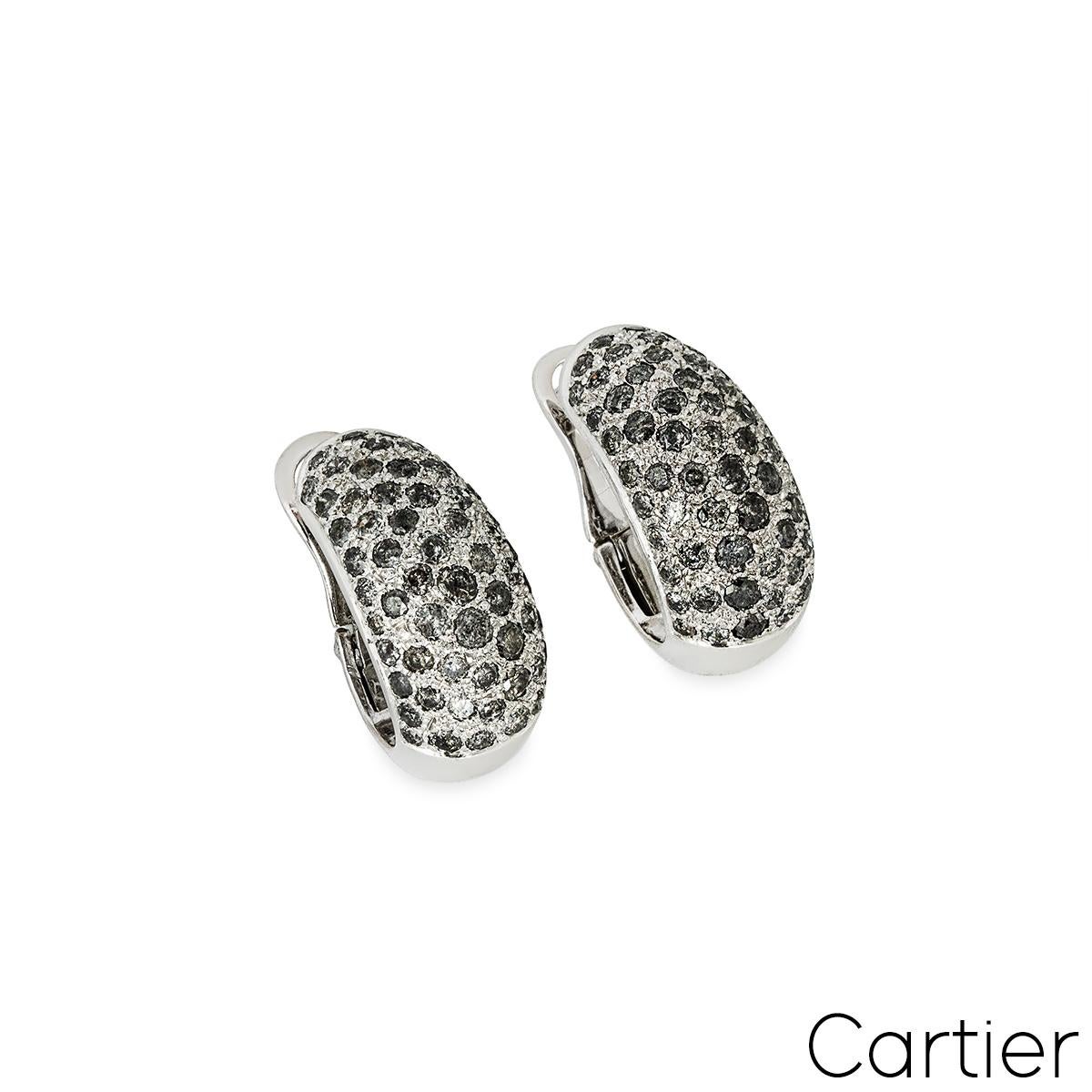 A stunning pair of 18k white gold clip-on earrings by Cartier from the Sauvage Metissage collection. Each bombe earring comprises of approximately 57 pave set grey round brilliant cut diamonds, with a total approximate weight of 2.20ct. The earrings