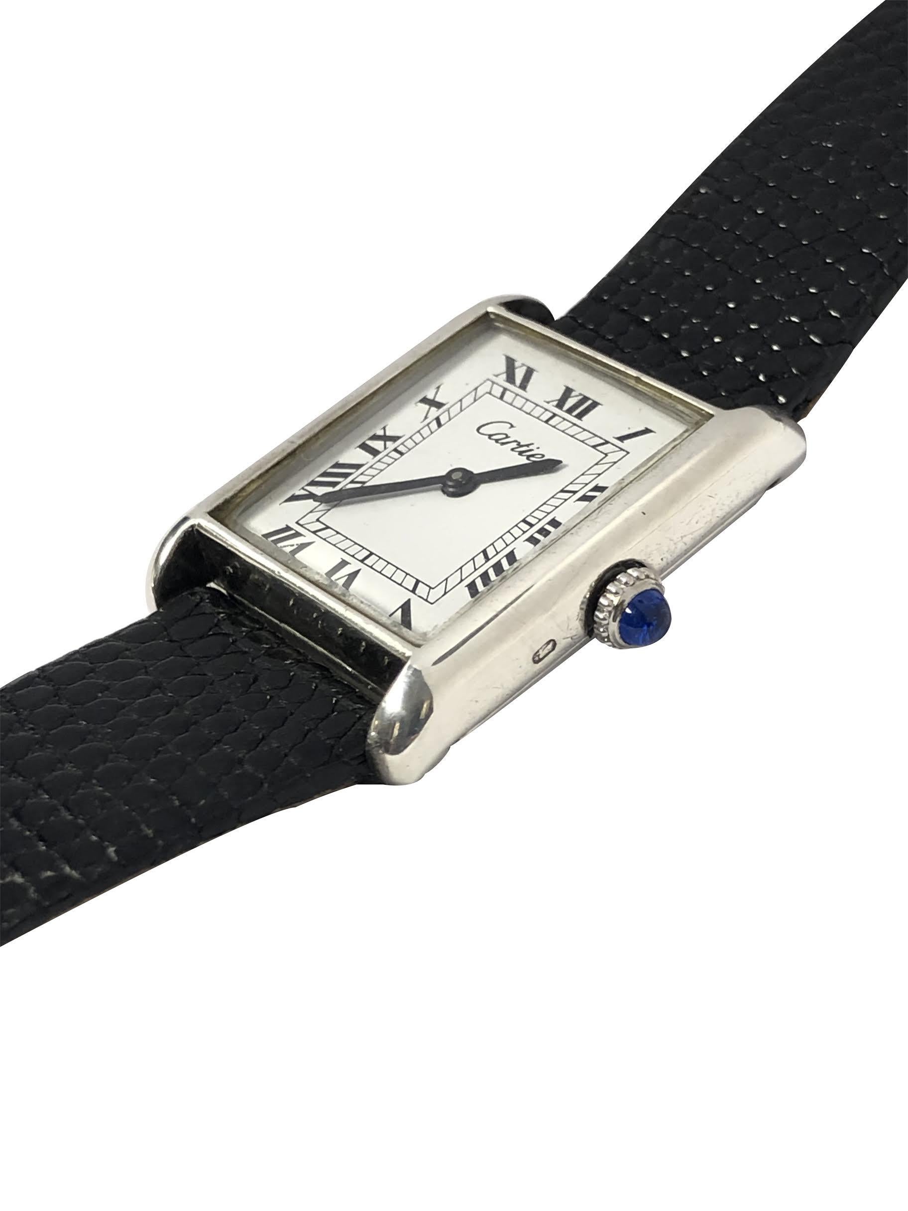 Circa 1980 Cartier Classic Tank Wrist Watch, 30 X 23 M.M. Sterling Silver 2 Piece Case, 17 Jewel Cartier, mechanical, Manual wind movement. White Dial with Black Roman Numerals, Sapphire Crown. New Black Lizard Strap with original Cartier Logo