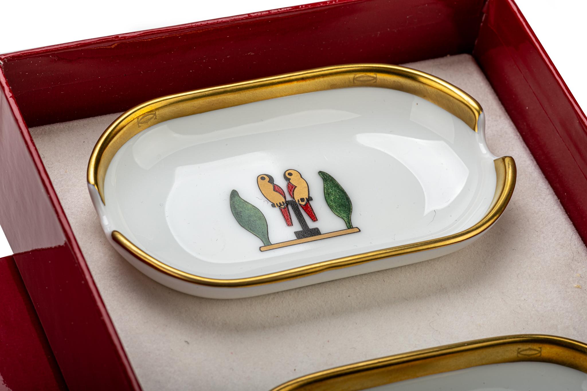 Cartier brand new in. box set of three small oval dishes. Limoges porcelain made in France. Signature burgundy box.