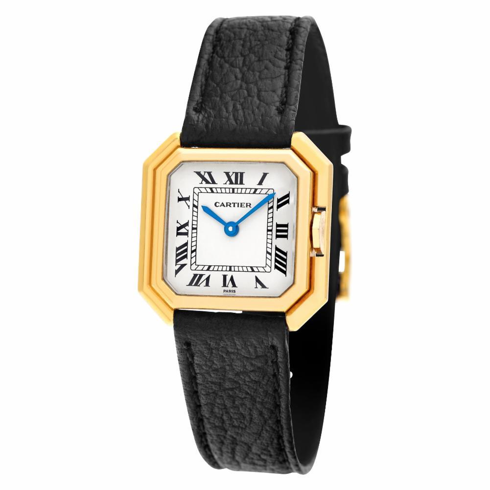 Ladies Cartier Paris Sextavado in 18k on leather strap with Cartier tang buckle. Manual. 22 mm case size. Circa 1980's. Fine Pre-owned Cartier Watch. Certified preowned Classic Cartier Sextavado 78099 watch is made out of yellow gold on a Black