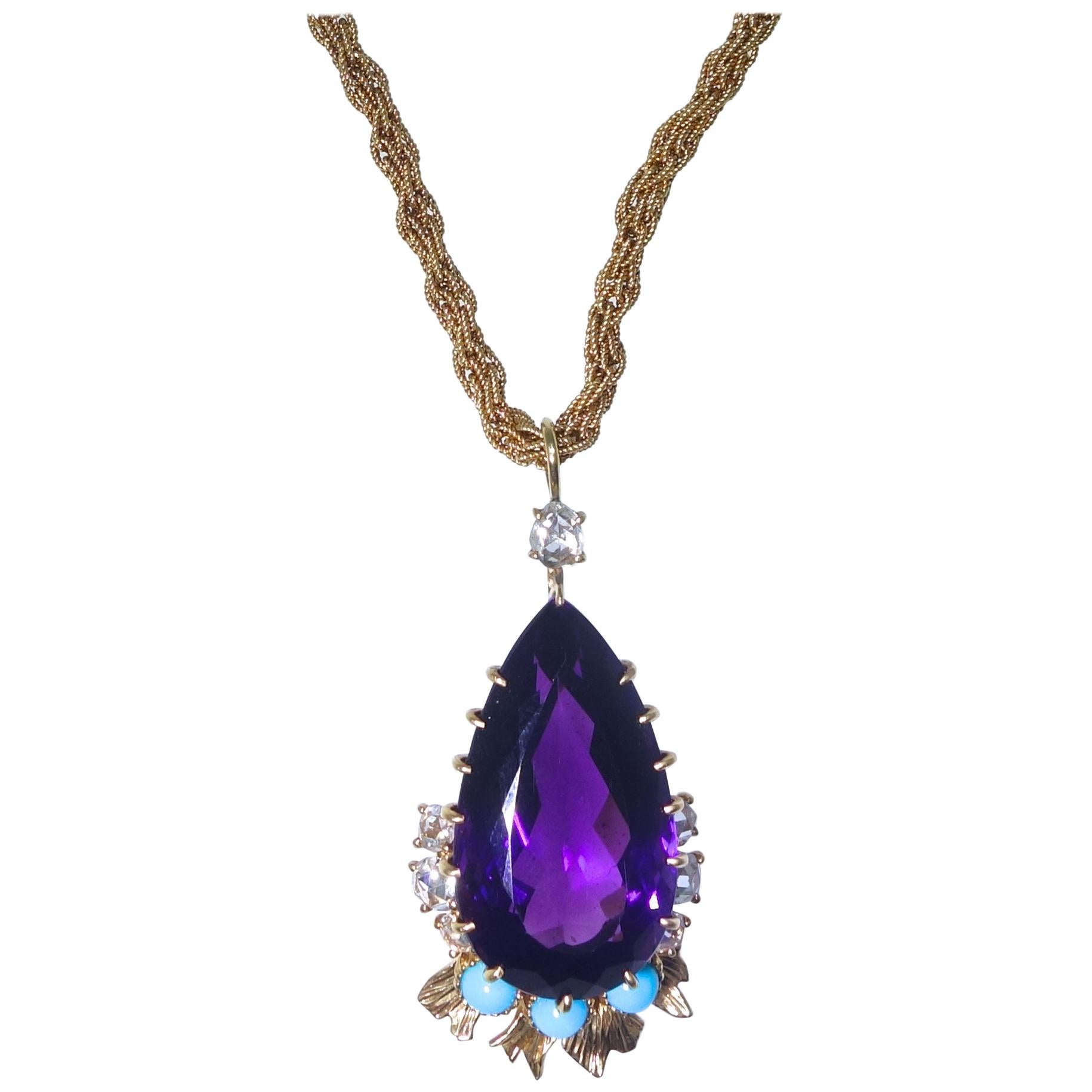 Cartier has set a very fine natural Siberian amethyst as a tear drop, accented with rose cut diamonds and Persian Turquoise from a Cartier 18K gold chain.  This center stone which has wonderful flashes of red - a hallmark of fine amethysts from