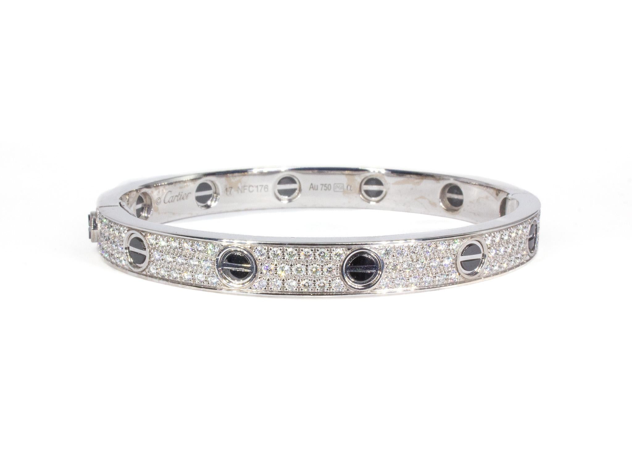 The Cartier LOVE Bracelet in white gold with black ceramic is a modern and striking expression of timeless elegance. Crafted in 18K white gold and accented with sleek black ceramic, this design features 204 brilliant-cut diamonds, totaling 1.99