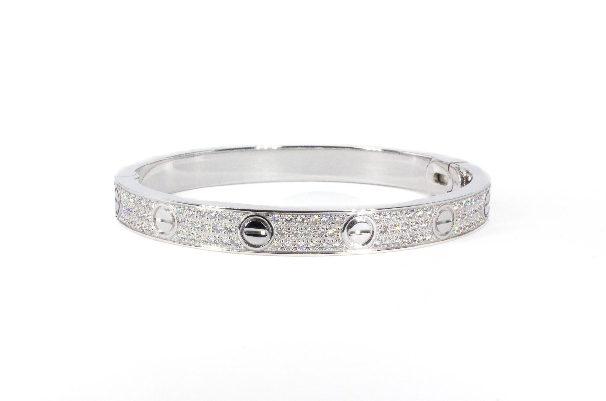 The Cartier LOVE Bracelet in white gold is a bold and luxurious symbol of eternal commitment. Expertly crafted in 18K white gold, this design dazzles with 204 brilliant-cut diamonds, totaling 1.99 carats. The carefully placed diamonds enhance the