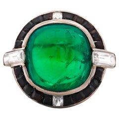 Anello in platino con smeraldo colombiano, onice e diamante firmato Cartier Art Deco