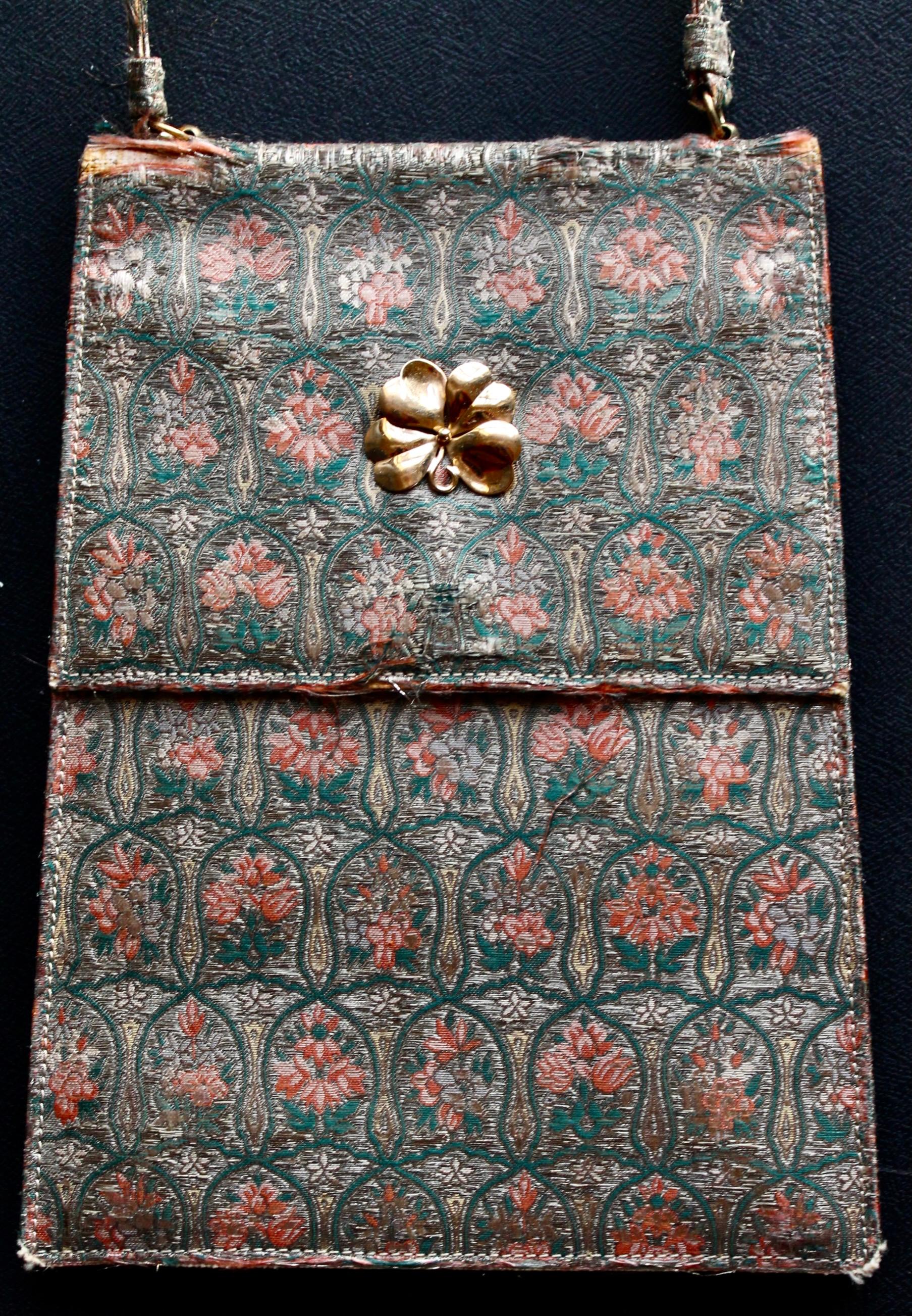 Cartier Art Deco Evening Bag.  Silk with gold thread makes an overall floral pattern.  Gold clasp (untested)  Silk interior  with a gilt monogram J.W.T., and signed Cartier. 7