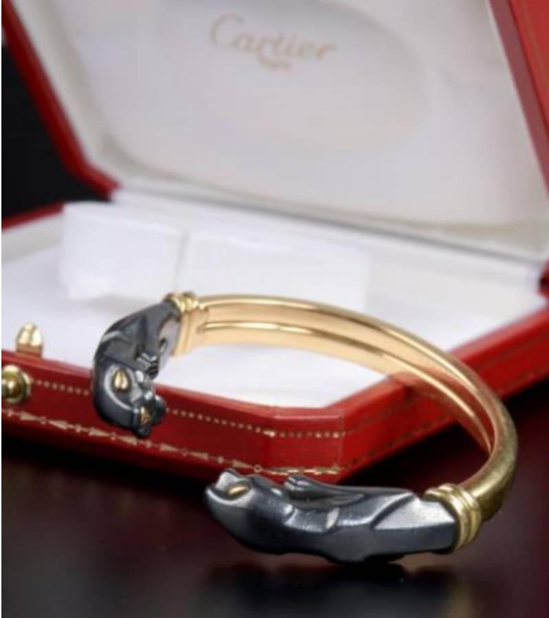 Cartier Silver and Gold Panther Cuff Bracelet In Excellent Condition In Geneva, CH