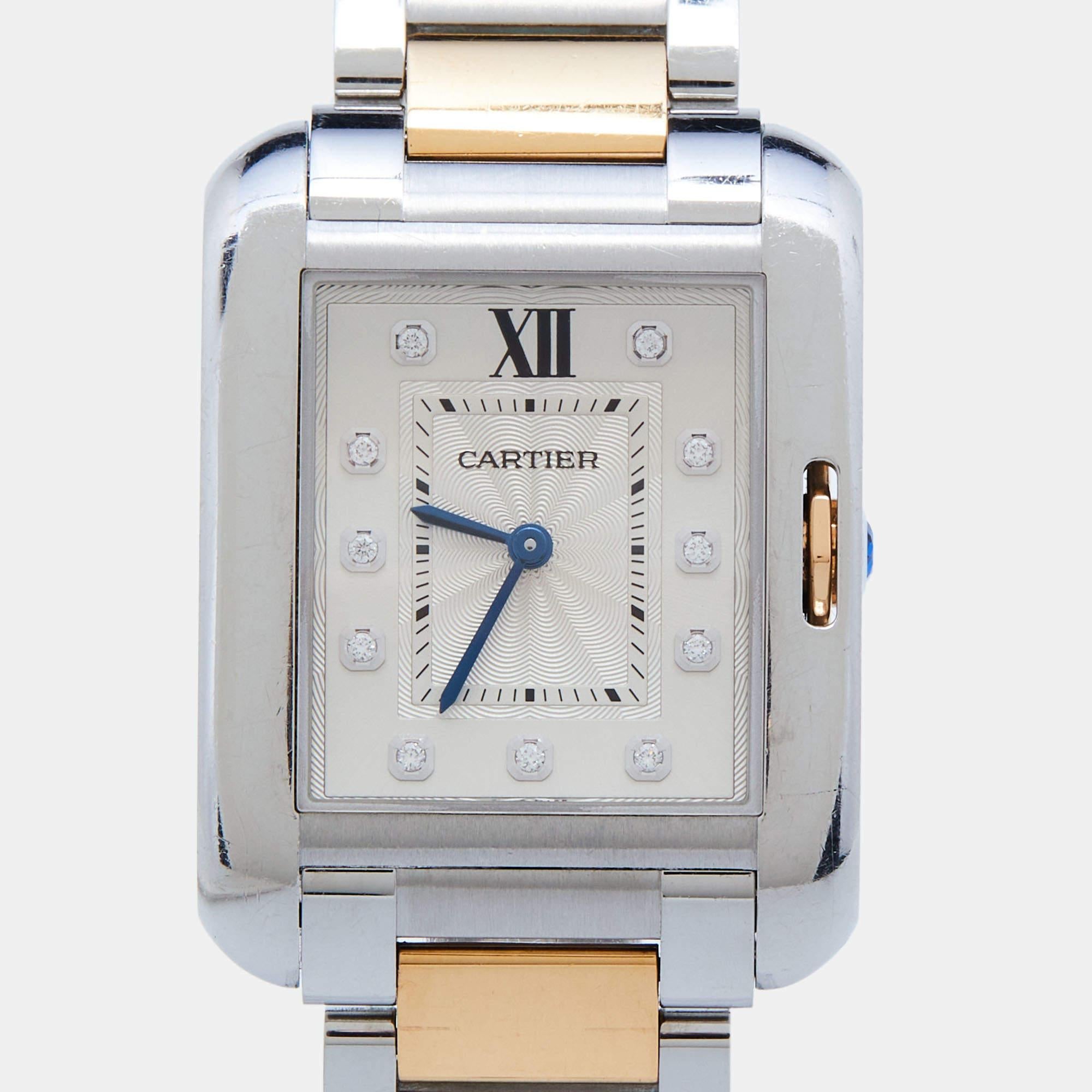 This Cartier timepiece is a must-have creation for watch enthusiasts! Made using 18k rose gold and stainless steel, this Tank Anglaise watch has a silver dial with diamond hour markers, a Roman numeral marker at 12, and steel hands in a blue hue.