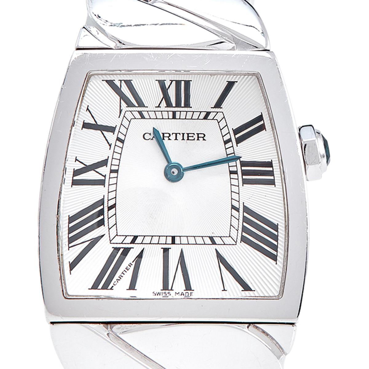 Wristwatches work as well as jewelry when accessorized right. Take a look at the beauty of this Cartier. It comes made from 18k white gold with a braid-like bracelet, fully ready to charm. The 28mm case protects the silver dial fixed with Roman
