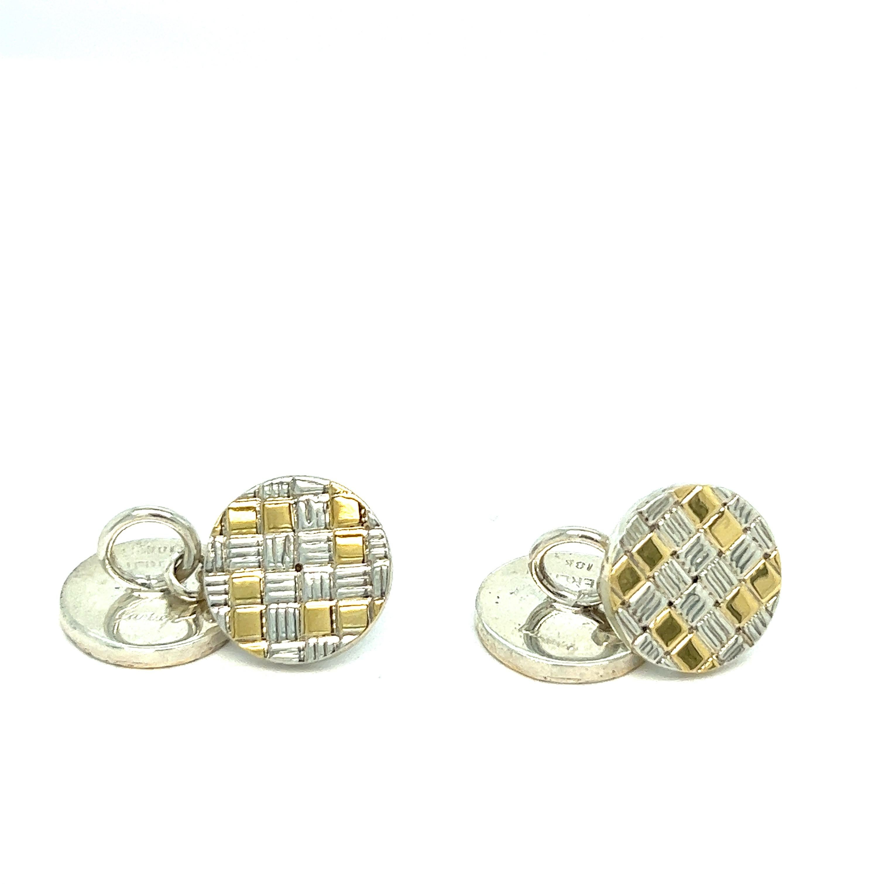 Pair of 18k gold and sterling silver small cufflinks by Cartier. Each top is 14 mm in diameter. Marked: Cartier, Sterling, 18k. Weight - 13.2 grams.