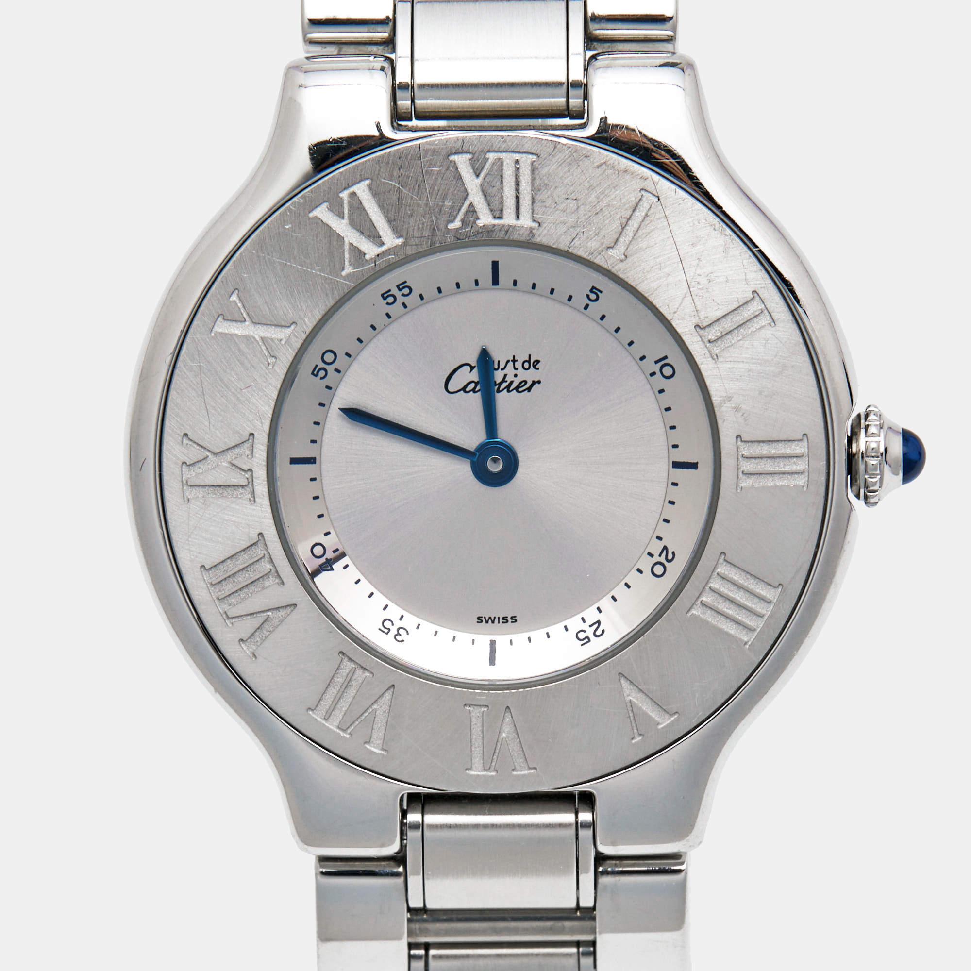 The Cartier Must De Cartier 21 1330 women's wristwatch is an exquisite timepiece that combines classic elegance with modern functionality. It features a sleek stainless steel case and bracelet, with a luxurious silver-grey dial adorned with the