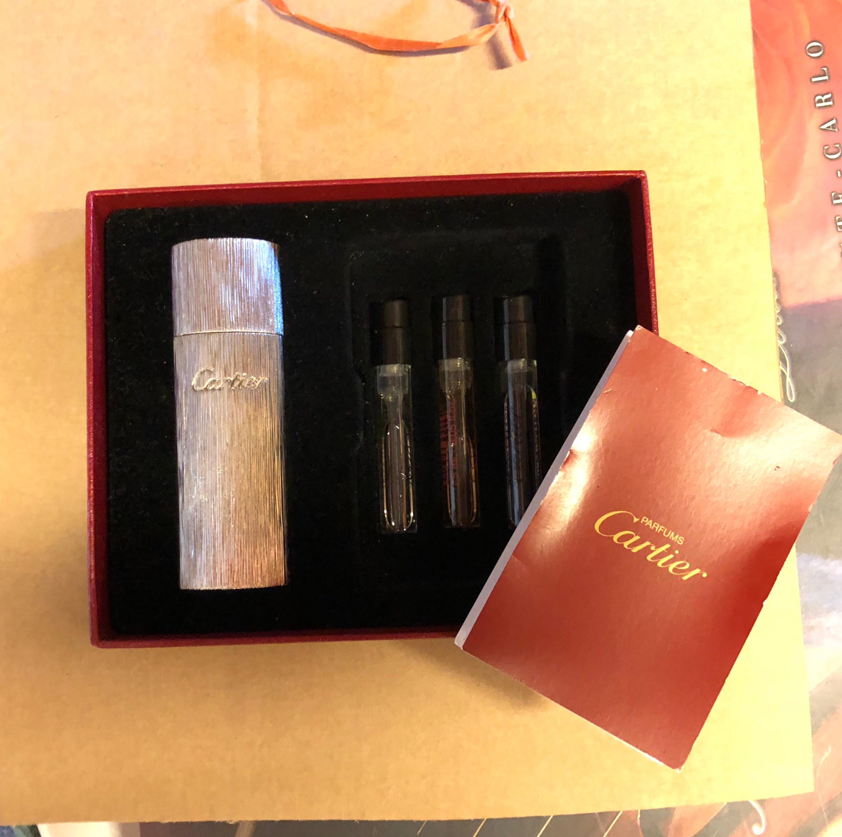 Authentic Cartier silver refillable pocket perfume purse spray

Vaporisatuer de Sac Rechargeable, refillable pocket spray parfum vial/bottle with cover
The beautiful metal casing is a carved silver-finished oval and comes with 3 1.5 ML Cartier