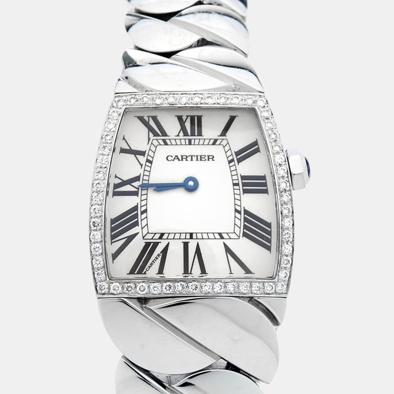 Wristwatches work as well as jewelry when accessorized right. Take a look at the beauty of this Cartier. It comes made from stainless steel with a braid-like bracelet and a diamond-embellished bezel, fully ready to charm. The silver dial is fixed