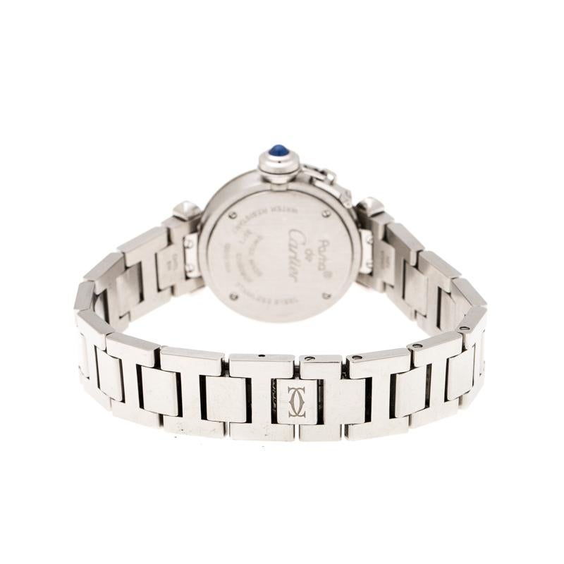 Dazzle the eyes that fall on you when you flaunt this Pasha de Cartier timepiece on your wrist. Swiss made and crafted from stainless steel, this watch features Arabic numerals on a silver dial with a smooth bezel. It follows a quartz movement and