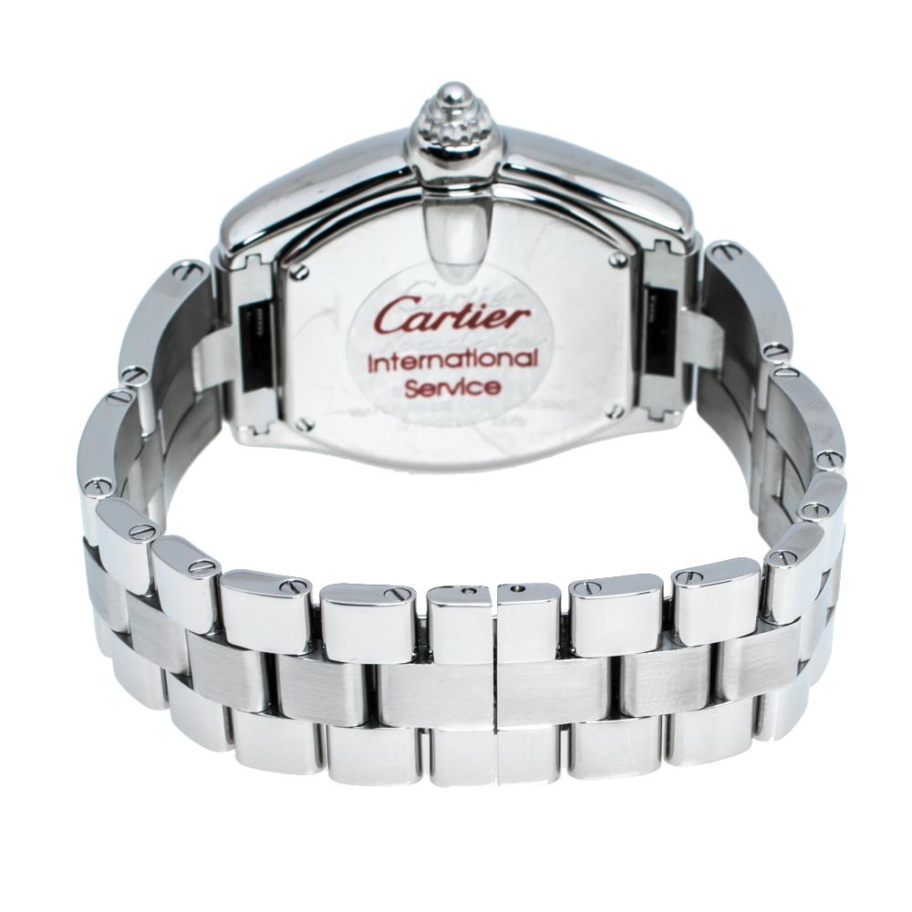 Designed with an amazing blend of luxury and fine craftsmanship, this Roadster watch from Cartier is sure to delight your style. In a stainless steel tonneau-shaped case, the watch functions in a quartz movement. A scratch-resistant sapphire crystal