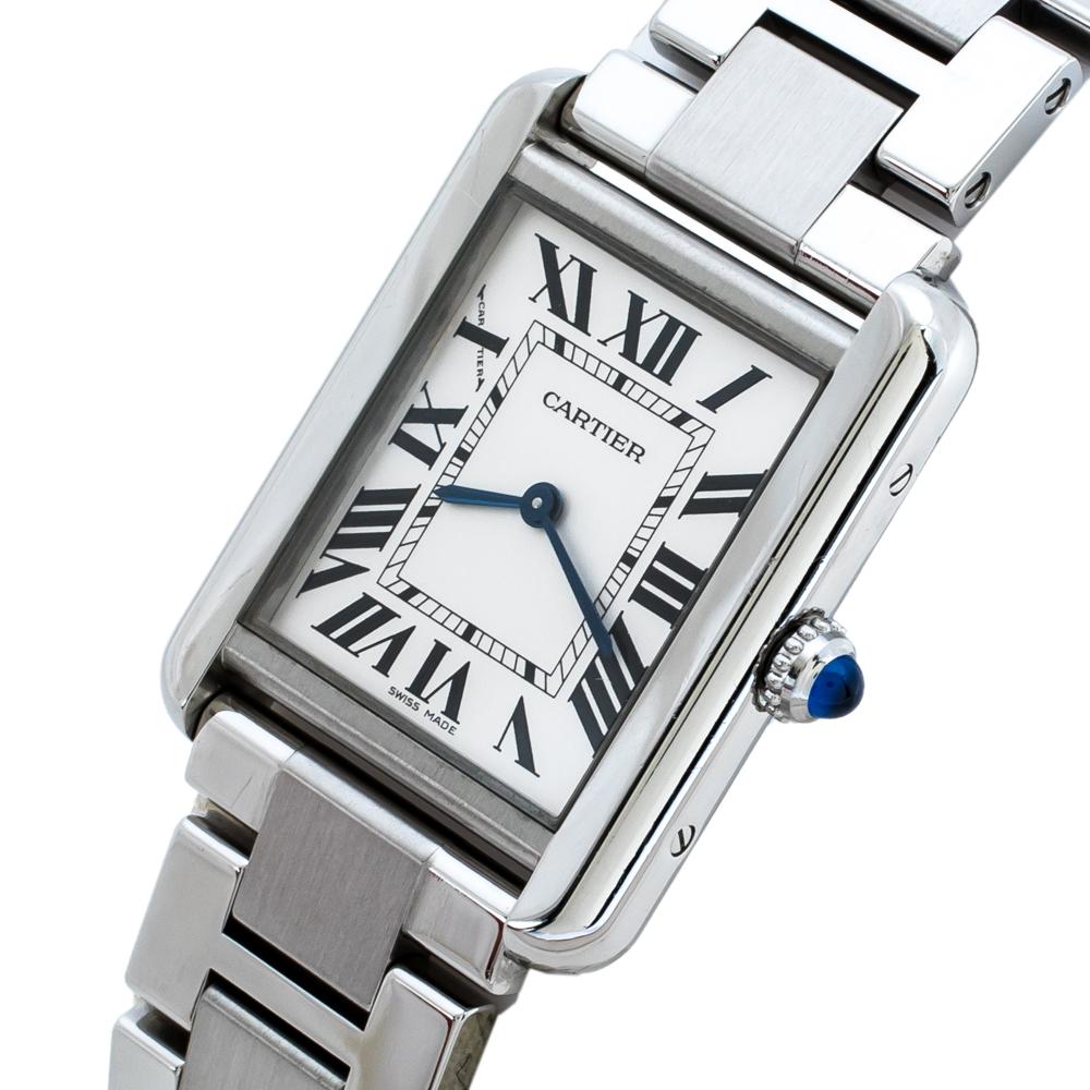 Be chic with this wristwatch from Cartier. The watch has a rectangular stainless-steel case and a matching smooth bezel. It encases a silver dial that features black Roman numerals as hour-markers and signature blue hands. The watch is secured by a