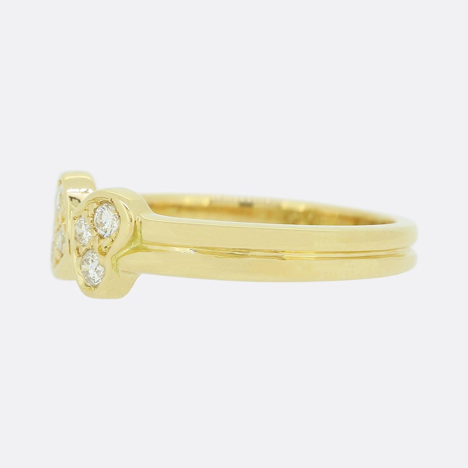 Here we have a beautiful vintage diamond ring from the world renowned luxury jewellery house of Cartier. The face of the ring has been crafted into the shape of two love hearts; each of which has been set with a trio of round brilliant cut diamonds.