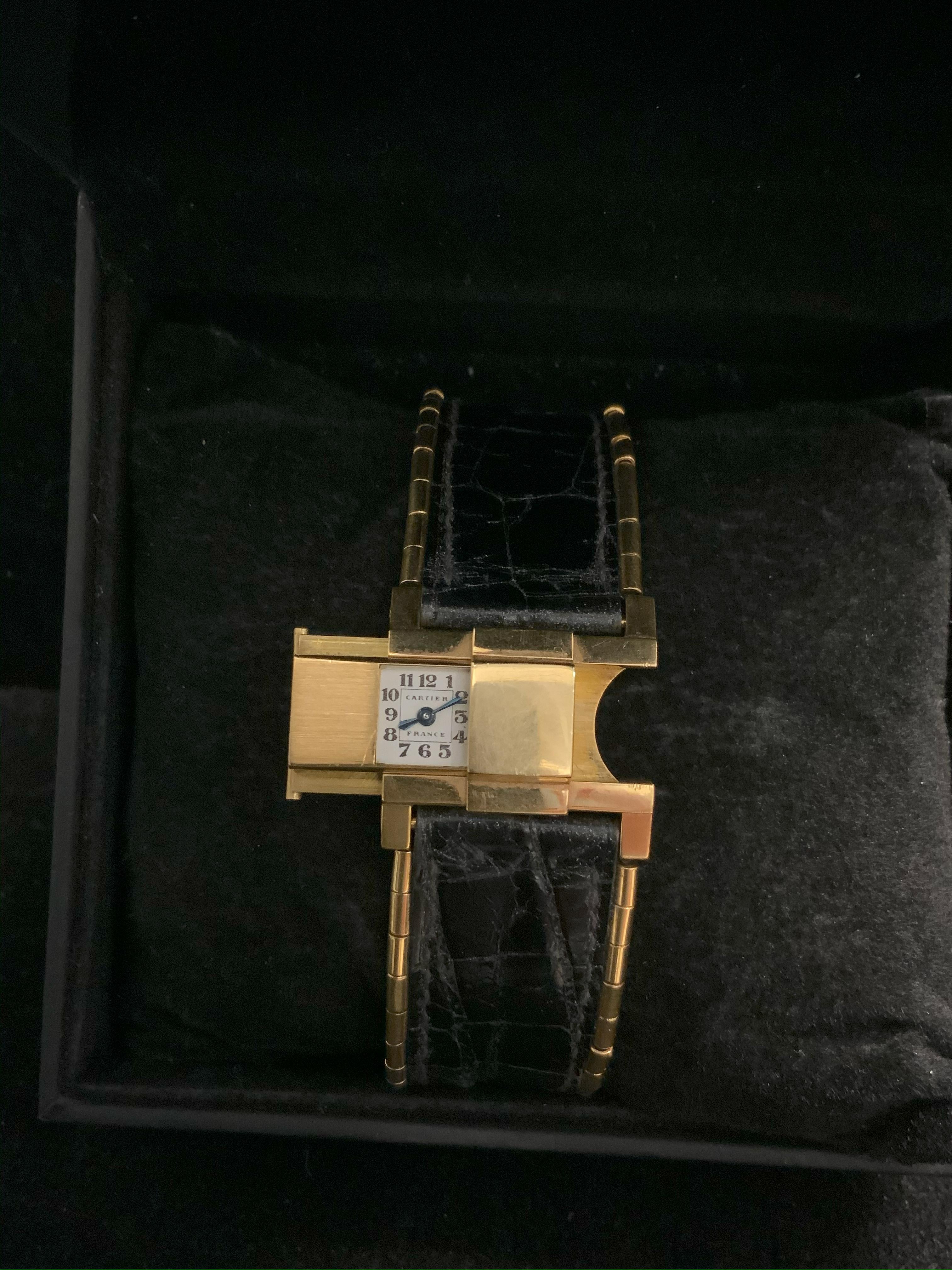 CARTIER Slide Watch w/ 18K Yellow Gold & Hidden Watch Face

The joy of wearing a piece of art on your wrist is within reach when you grab this Cartier Slide Watch. This unisex timepiece features a beautiful 18K Yellow Gold case that measures