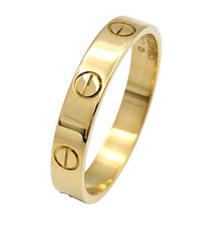 Cartier Small Model LOVE Band Ring in Polished 18 Karat Yellow Gold Size 57