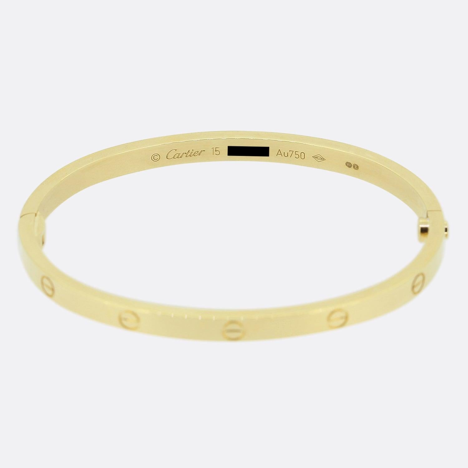 Here we have an 18ct yellow gold bangle from the world renowned luxury jewellery house of Cartier. This bangle forms part of the LOVE collection and features the iconic screw motif around the entire outer edge. This is the slimmer/thin model with a
