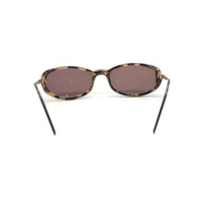 Cartier Small Tortoiseshell Sunglasses

-Silver tone hardware 
-Rectangle shape 
-Black tint lenses 
-Fully rimmed 

Material: 

Acetate 

Made in france 

9.5/ 10 excellent conditions, please refer to images for further details. 

PLEASE NOTE,