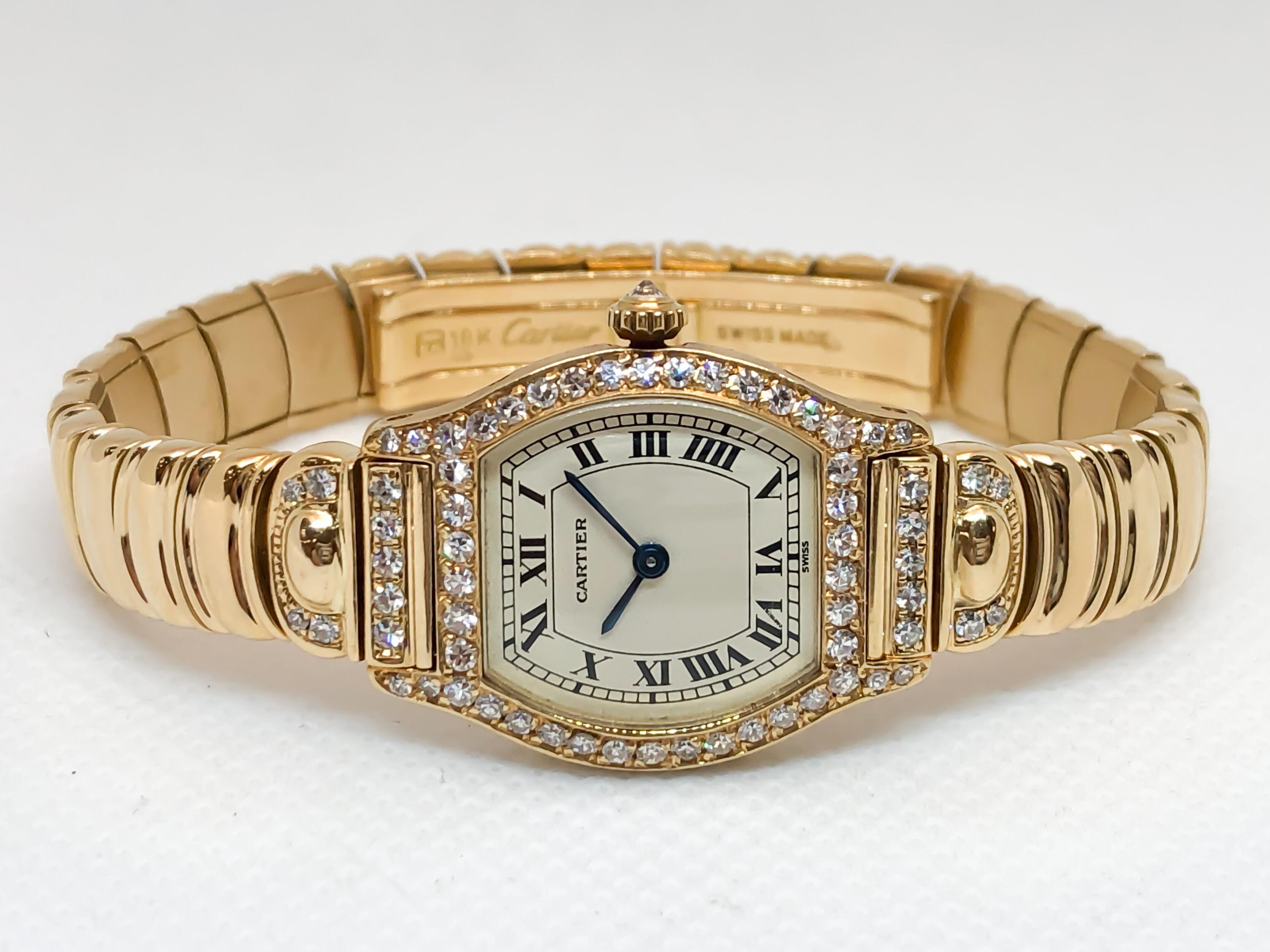 Rare Cartier Tortue designed in 18 karat yellow gold on a curved link polished bracelet. Factory set diamonds accent the case, lugs and crown. Fresh battery and one year warranty.

MOVEMENT: QUARTZ BATTERY
CASE MATERIAL: 18K YELLOW GOLD
CONDITION: