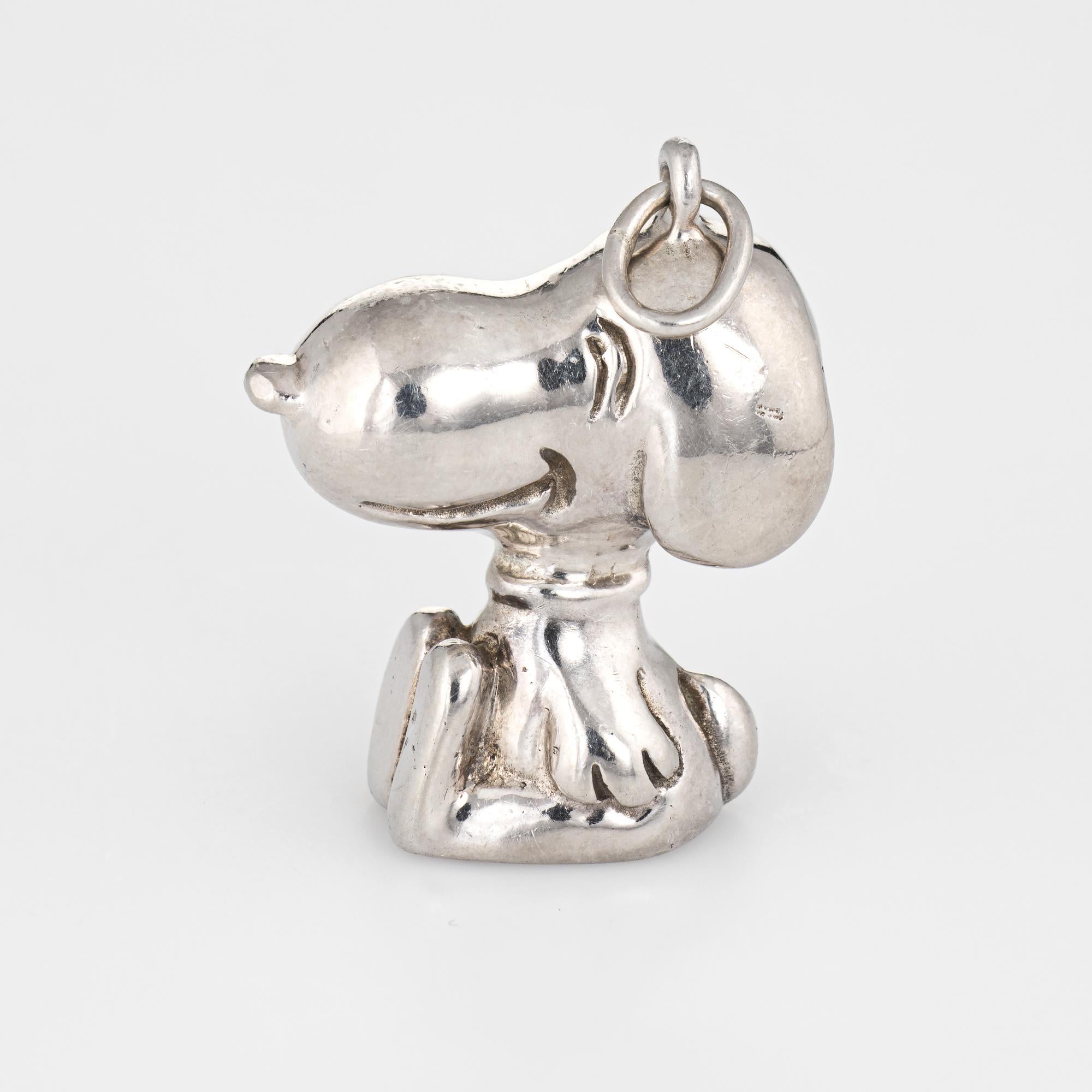 Finely detailed vintage Cartier Snoopy charm crafted in sterling silver.  

The charm (also wearable as a pendant) is a rare find on the market today. Traditionally Cartier has sold good luck charms. The Snoopy charm was introduced in 1958-66