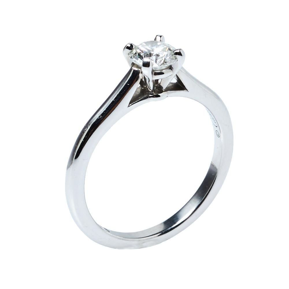 Keep it classic and exquisite with this gorgeous Cartier engagement ring. Forged in platinum and set with a brilliant solitaire, this ring boasts of excellent distinctiveness and artisanship. This captivating ring is a true testament to true and