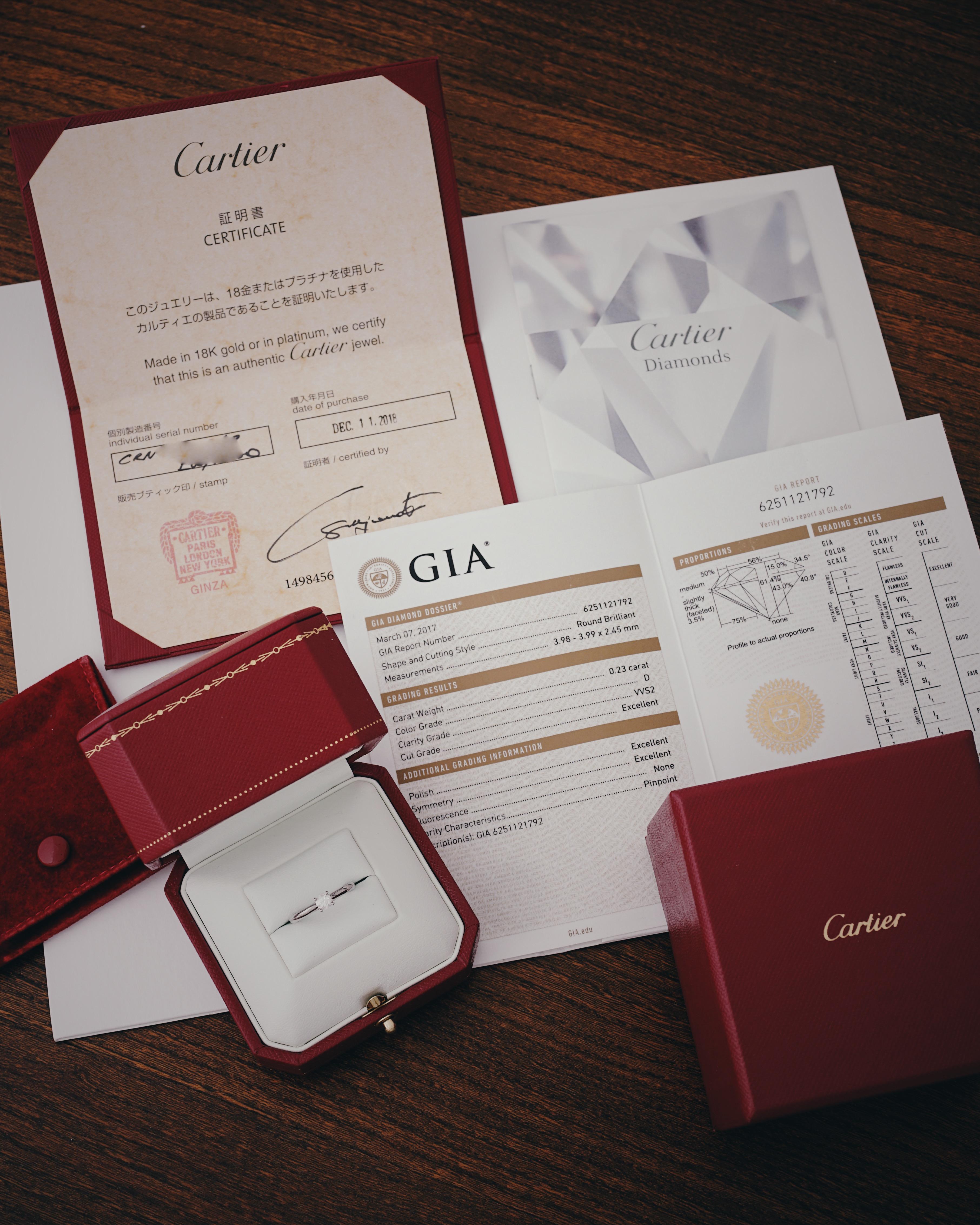 Cartier, Solitaire 1895,
Round Brilliant Cut
GIA certified 0,23 Carat, D Color and VVS2 Clarity and Triple X quality.
Mounted in Platinum 950/1000.
Signed Cartier, and numbered. Size 49 (US 5).
GIA number inscribed, report N° 6251121792
Comes full