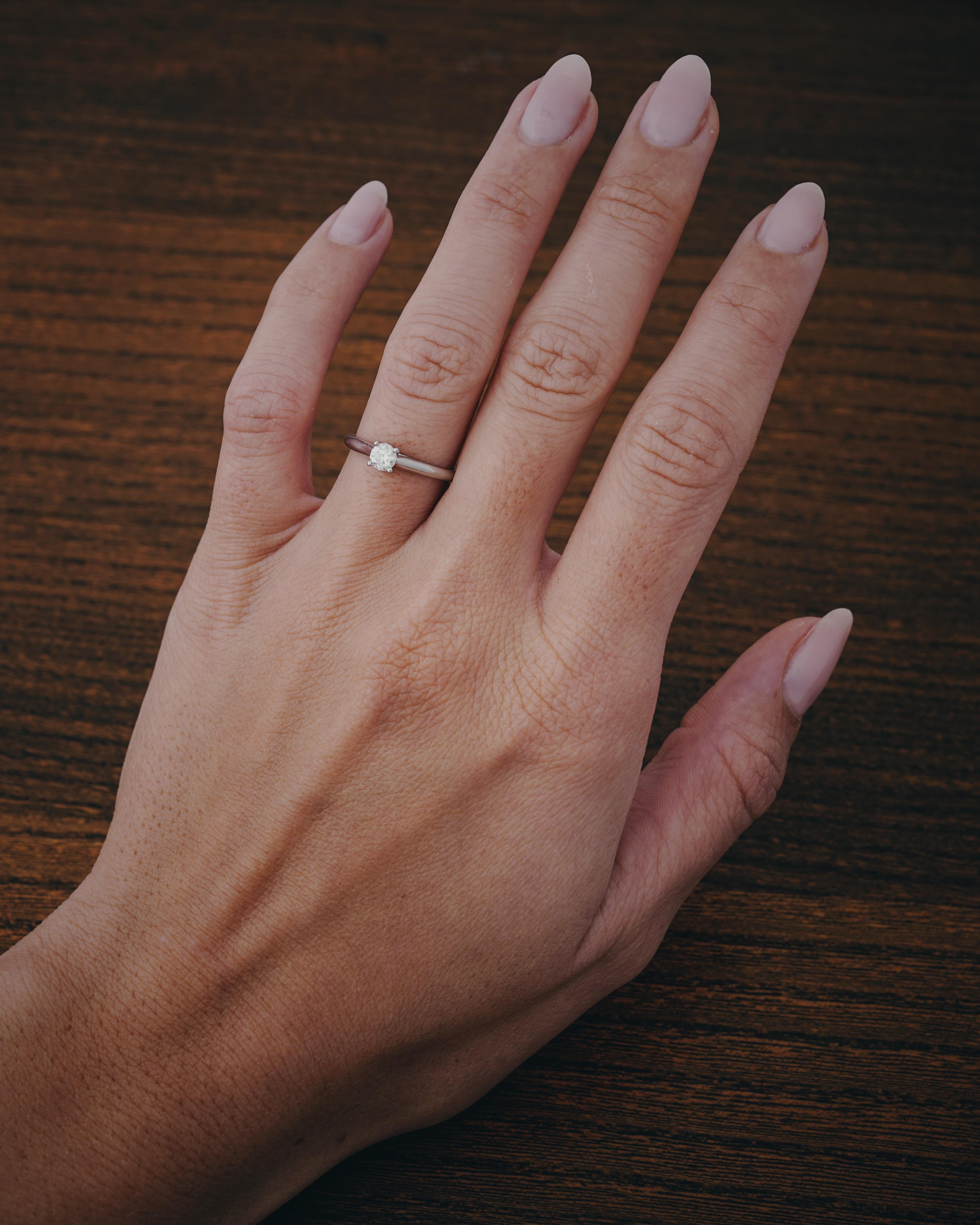 Contemporary Cartier, Solitaire 1895 Round Cut GIA 0.23 Carat D/VVS2 Diamond Ring For Sale