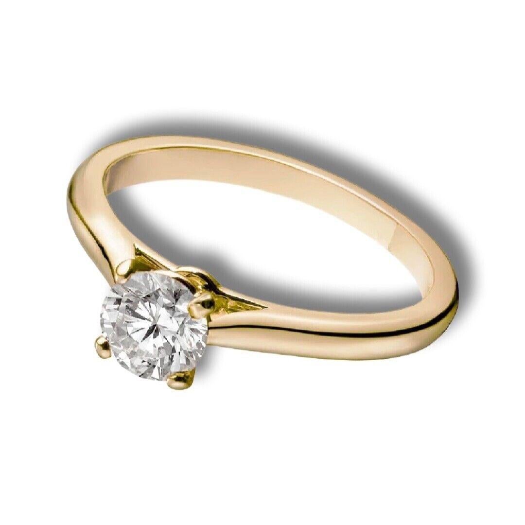 Style: Engagement Single Solitaire Diamond Ring

Brand: Cartier

Collection: Solitaire 1895

Metal: Yellow Gold 

Metal Purity: 18K

Center Stone: 1 Round Diamond

Center Stone Carat Weight: 0.53 ct

Ring Size: 52 (euro) - can be sized but will be