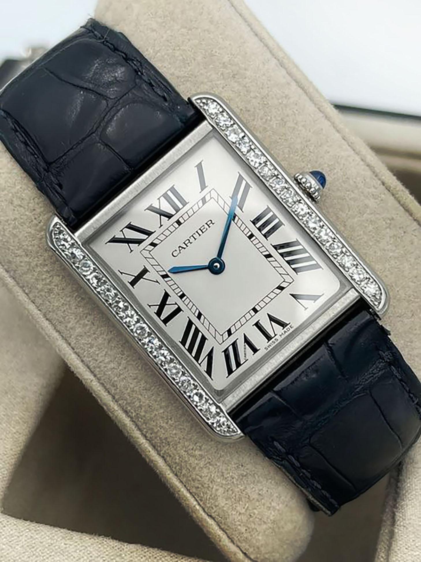 CARTIER Solo Tank Watch
Supplied with its carrying case
Black crocodile strap.
CIRCA 2011
WATER RESISTANT
Steel, diamonds, quartz and sapphire crown.
Cartier buckle, white dial with Roman numerals.
Length: 27mm
